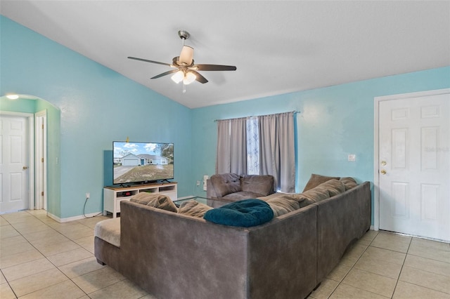 tiled living room featuring vaulted ceiling and ceiling fan