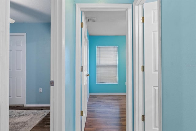 hallway featuring dark hardwood / wood-style floors