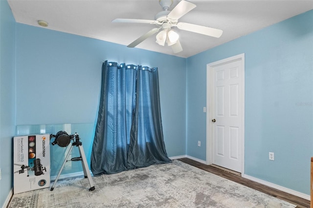 interior space featuring hardwood / wood-style flooring and ceiling fan