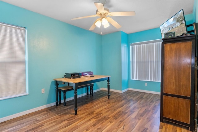 office area featuring wood-type flooring and ceiling fan