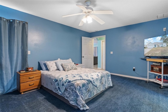 bedroom with dark carpet and ceiling fan