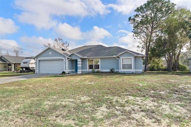 ranch-style home with a garage and a front yard