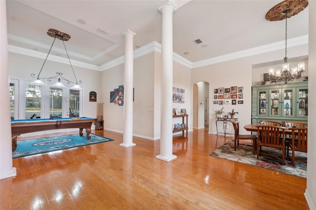 rec room with pool table, hardwood / wood-style floors, crown molding, and decorative columns