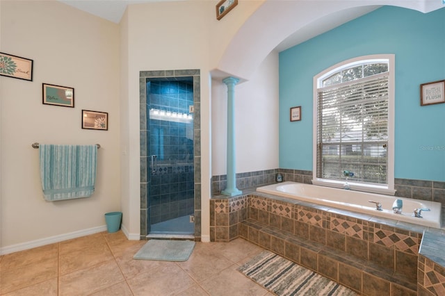 bathroom with ornate columns, plus walk in shower, and tile patterned flooring