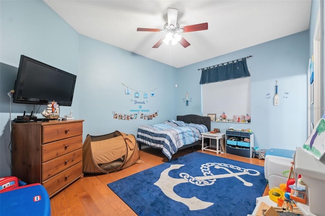 bedroom with hardwood / wood-style flooring and ceiling fan