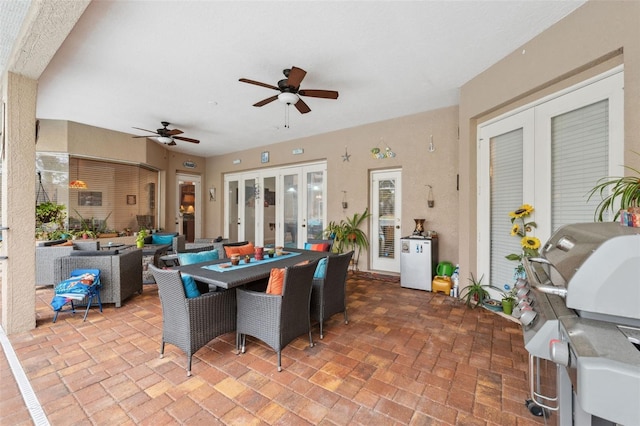 view of patio / terrace featuring french doors, ceiling fan, and area for grilling