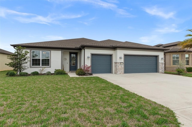 prairie-style house with a front lawn, concrete driveway, an attached garage, and stucco siding