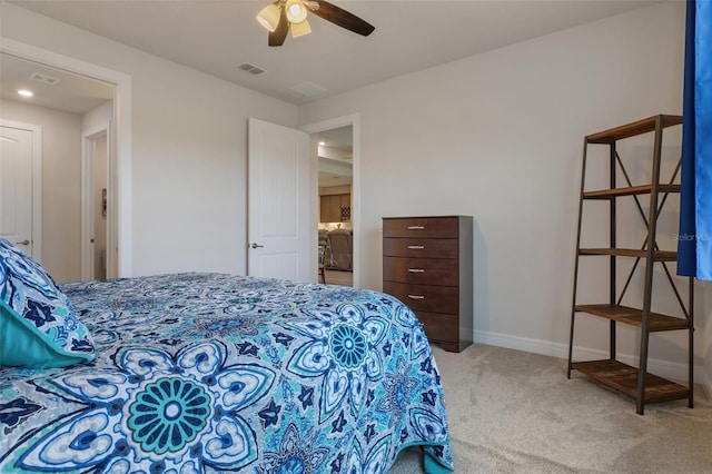 carpeted bedroom featuring visible vents, ceiling fan, and baseboards