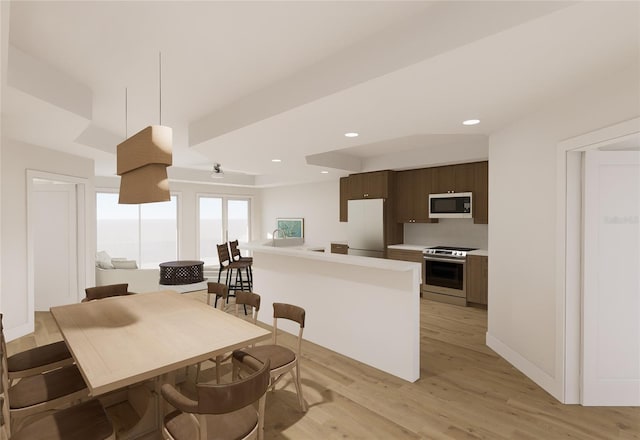 kitchen featuring white microwave, electric range, light countertops, dark brown cabinets, and fridge