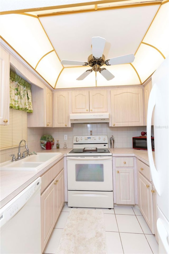 kitchen featuring sink, white appliances, light tile patterned flooring, and backsplash