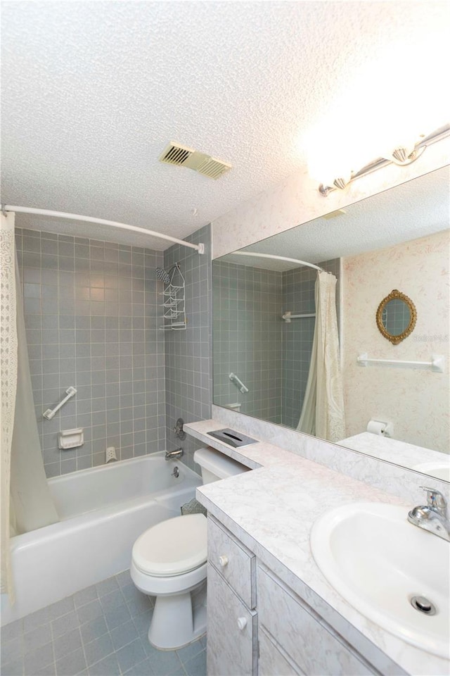 full bathroom with shower / bath combination with curtain, tile patterned floors, a textured ceiling, and toilet