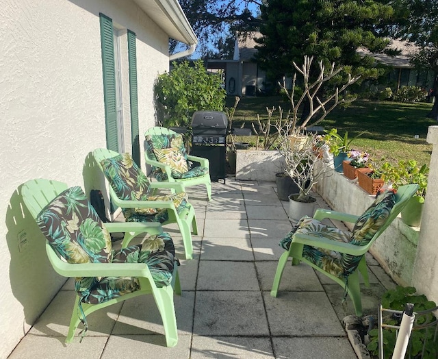 view of patio with a grill