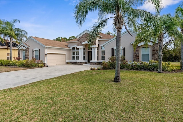 view of front of home with a garage and a front lawn