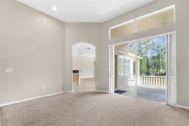 spare room with light colored carpet