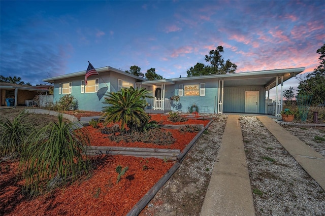 view of front of home featuring a carport