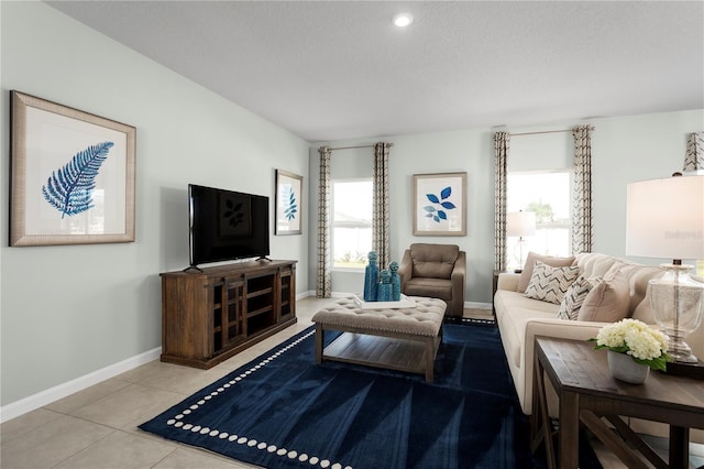 tiled living room with a textured ceiling