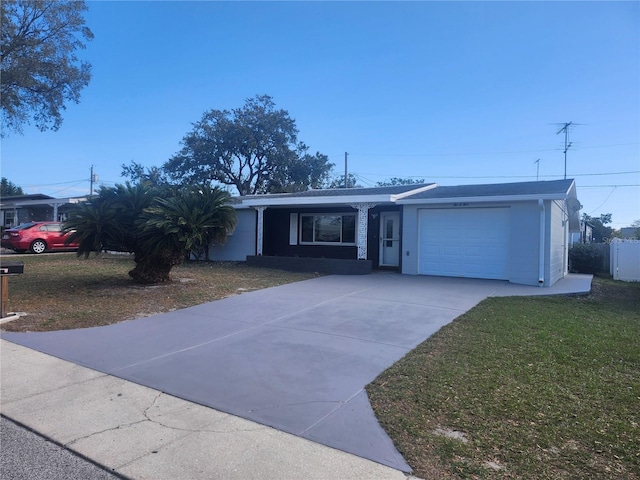 single story home featuring a garage and a front yard