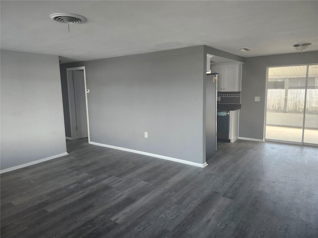 unfurnished living room featuring dark wood-type flooring