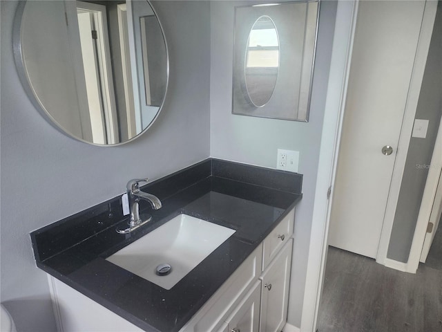 bathroom with vanity and hardwood / wood-style floors