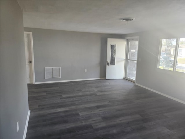 empty room featuring dark hardwood / wood-style floors