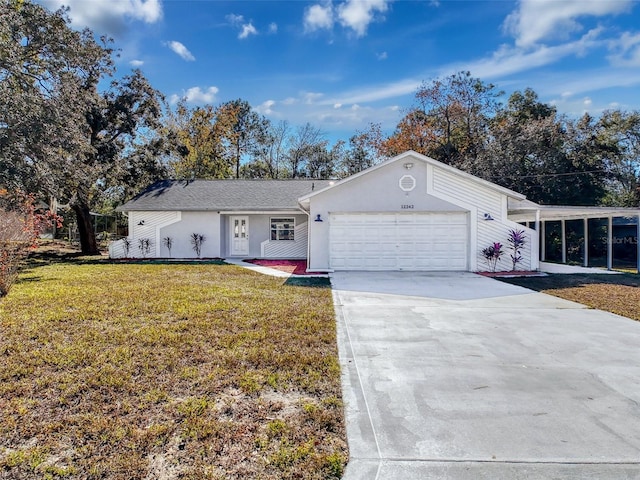 ranch-style home with an attached garage, driveway, a front lawn, and stucco siding