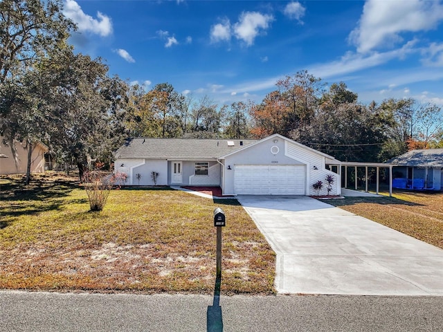 ranch-style home with a front yard, driveway, and an attached garage