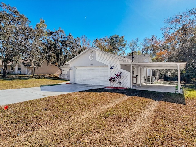 exterior space featuring a garage, a lawn, and concrete driveway