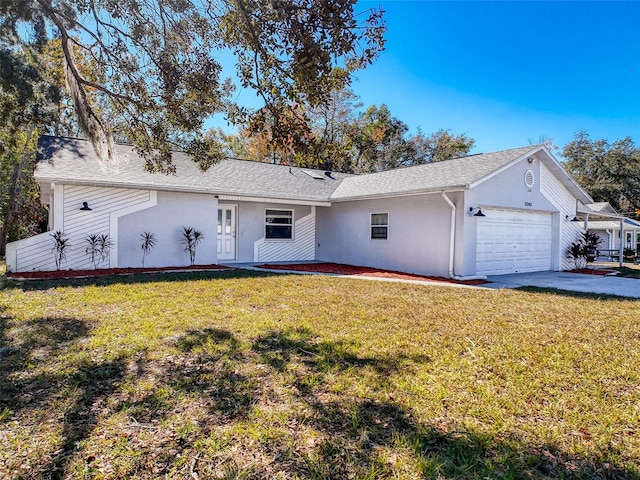 ranch-style home featuring roof with shingles, stucco siding, an attached garage, driveway, and a front lawn