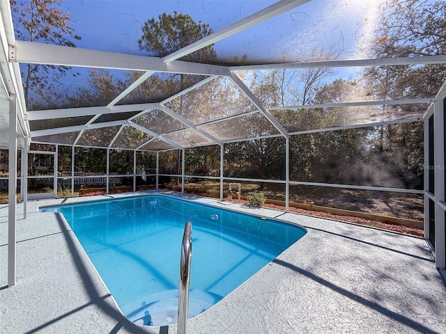 outdoor pool featuring a patio area and a lanai