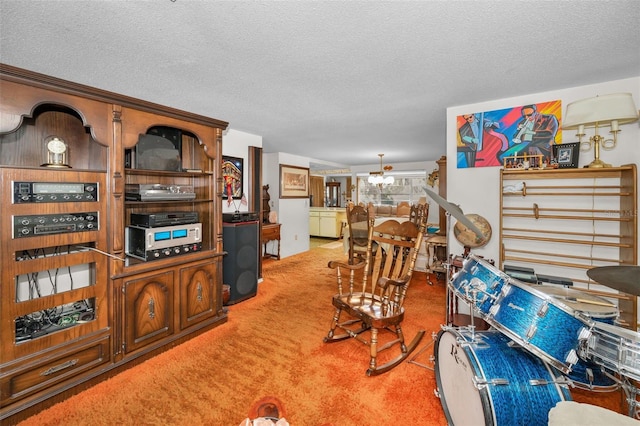 living room with carpet floors and a textured ceiling