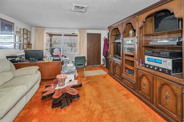 living area with light colored carpet, a textured ceiling, and visible vents