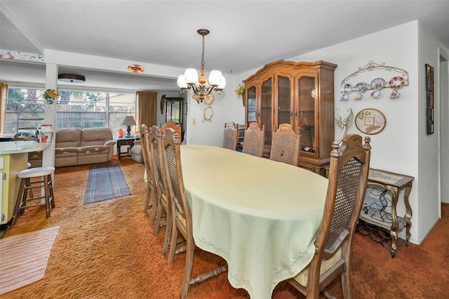 carpeted dining space featuring a notable chandelier