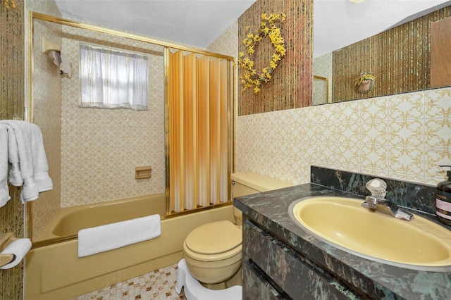 bathroom with vanity, shower / bath combo with shower curtain, and toilet
