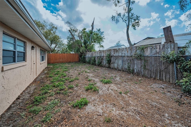 view of yard with a fenced backyard