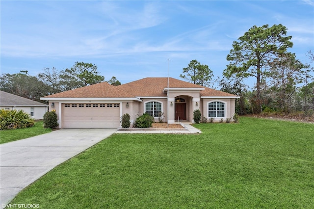 mediterranean / spanish-style house with concrete driveway, a front lawn, an attached garage, and stucco siding