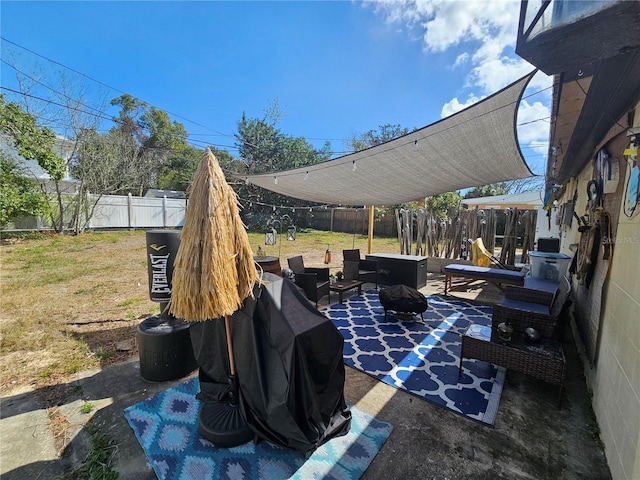 view of patio / terrace with an outdoor living space with a fire pit