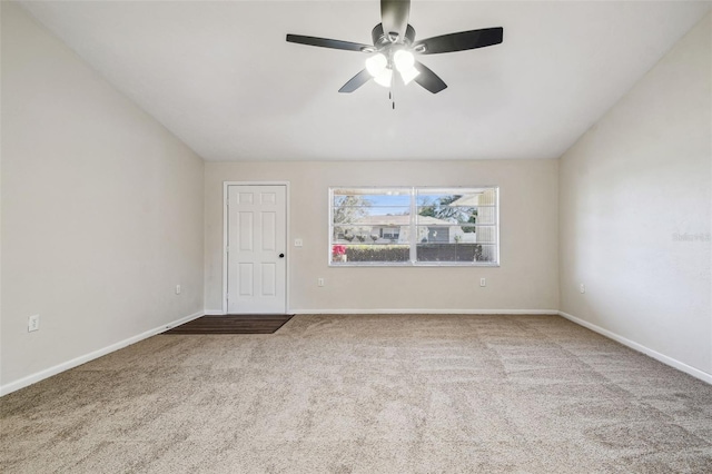 carpeted empty room with lofted ceiling and ceiling fan