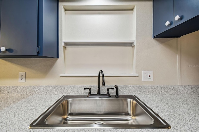 details with sink and blue cabinets