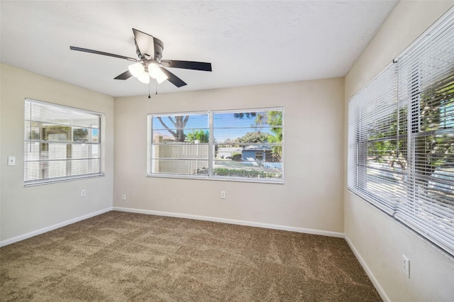 empty room featuring ceiling fan and carpet flooring