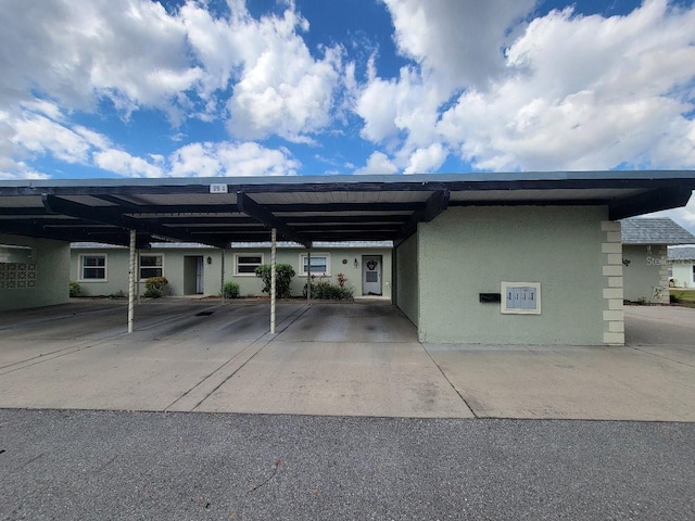 view of parking / parking lot with a carport