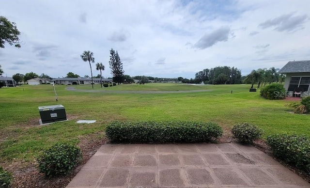 view of home's community featuring a lawn