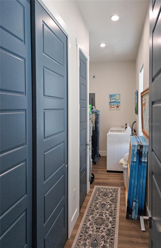 interior space with washer / dryer and dark hardwood / wood-style flooring