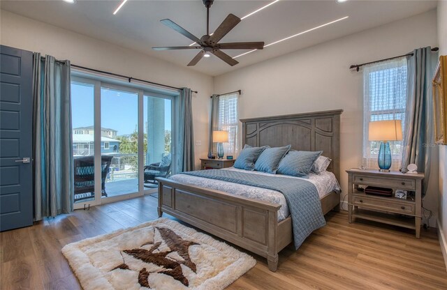 bedroom with access to exterior, ceiling fan, and light hardwood / wood-style flooring