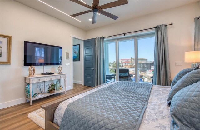 bedroom with ceiling fan and wood-type flooring