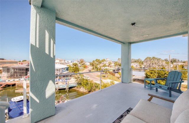 view of patio featuring a balcony