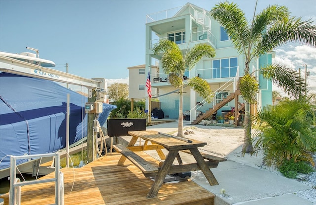 6613 Josie Ln, Hudson, FL 34667 - back of property with stairs, a patio area, and boat lift