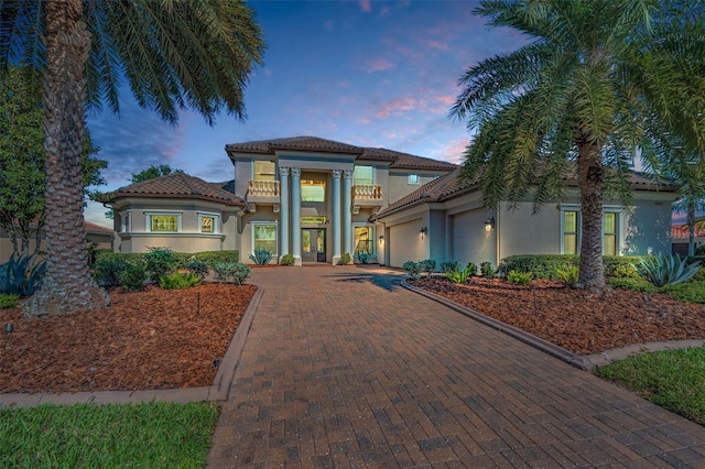 mediterranean / spanish house with a garage