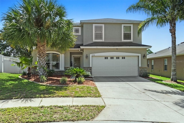 view of front facade with a garage and a front yard