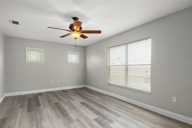 unfurnished room featuring ceiling fan and light hardwood / wood-style flooring