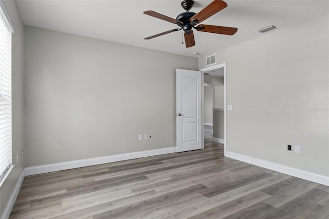 unfurnished room with ceiling fan and light hardwood / wood-style floors